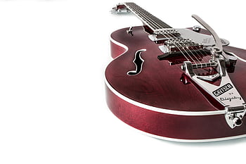 Red Jazz Guitar, Gretsch electric guitar, rich wood finish, metal accents, music lovers, white surface, elegant guitar, Bigsby, electric guitar, red guitar, white background