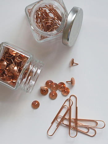 brown thumb tacks, paper clips, copper pins, glass jars, office organization, thumbtacks, paperclips, desk accessories, stationery, office supplies, copper office items