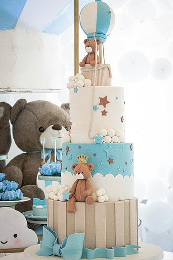 blue birthday cake, teddy bear, hot air balloon, tiered cake, adorable cake, blue decorations, star decorations, party cake, celebration cake, baby shower cake, festive cake