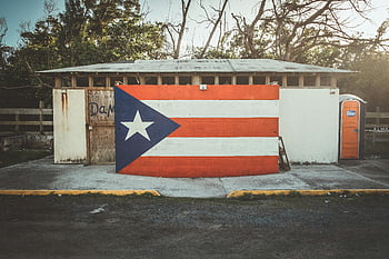 Puerto Rican flag, street art mural, San Juan, colorful mural, cultural expression, painted wall, Puerto Rico, vibrant art, outdoor mural, flag painting, Puerto Rican culture