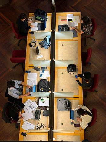 overhead-view-students-studying-collaborative-learning-diverse-college-students-laptops-shared-table-top-view-group-study-academic-environment-library-setting-thumbnail.jpg