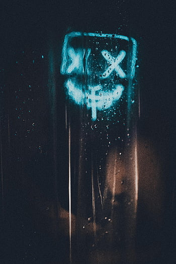 glowing LED purge mask, wet glass, water droplets, illuminated mask, dark background, LED light, glass surface, purge mask, water condensation, artistic lighting, mysterious atmosphere