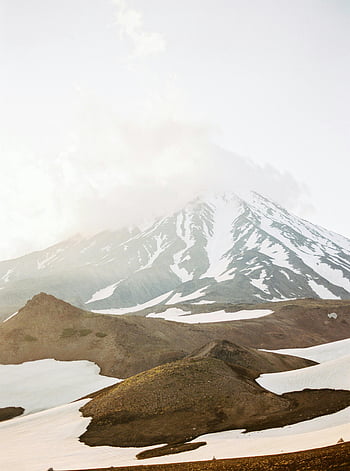 snow-capped mountain, snow-covered volcano, misty sky, Kamchatka, Russia, scenic view, stunning view, mountain landscape, winter scenery, natural beauty, volcanic landscape