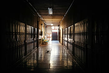 dark hallway, empty hallway, school hallway, distant light, moody atmosphere, lockers, dim lighting, long corridor, empty corridor, distant light source, dark corridor
