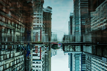 reflection photography, Hong Kong skyline, upside-down reflection, urban perspective, puddle reflection, cityscape photography, architectural photography, Hong Kong buildings, urban photography, city reflection, puddle art