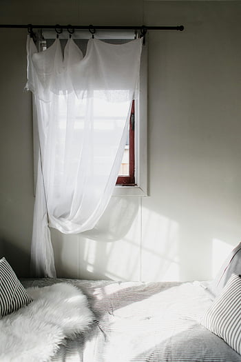simple bedroom, white curtain, window, sheer curtains, sunlight, cozy bed, inviting bedroom, natural light, interior design, home decor, minimalistic style
