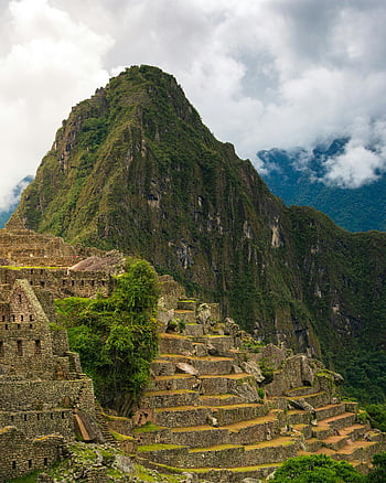 Machu Picchu, Inca ruins, Andes Mountains, Peru, ancient ruins, stunning views, clouds, mountain landscape, historical site, travel destination, South America