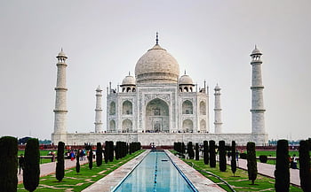 Taj Mahal, UNESCO World Heritage Site, Agra India, front view, iconic landmark, pool reflection, white marble, minarets, domed structure, garden pathway, tourist attraction