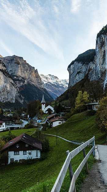 Lauterbrunnen village, Swiss Alps, picturesque view, stunning mountain backdrop, Swiss landscape, alpine village, mountain valley, Swiss countryside, scenic view, Swiss nature, Lauterbrunnen Switzerland