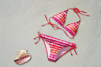 orange pink white stripe bikini, tie-dye bikini, sand beach, pink seashell, summer vibes, colorful bikini, beachwear, seashell, sand, beach fashion, summer fashion