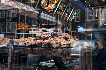 assorted pastries, display counter, Brussels bakery, window display, tempting array, pastries and sweets, bakery window, muffins, cupcakes, assorted sweets, bakery display