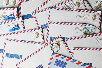 vintage airmail envelopes, stamps, postmarks, nostalgic design, close-up, retro mail, postage stamps, airmail letters, vintage stamps, postal history, envelope collection
