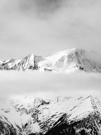 snow covered rocky mountain, monochrome view, snow-covered mountain peaks, misty mountains, black and white photography, winter landscape, mountain scenery, alpine view, high altitude, natural beauty, serene landscape