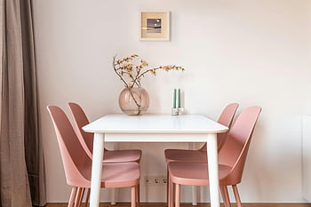 dining table, pink chairs, light dining room, minimalist dining room, floral centerpiece, serene dining room, white table, modern dining room, interior design, home decor, pastel chairs