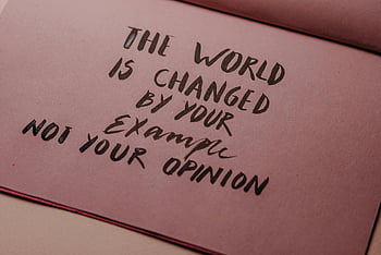 handwritten quote, motivational phrase, actions over words, textured paper, close-up shot, world changed, your example, not opinion, inspirational writing, motivational writing, handwritten text