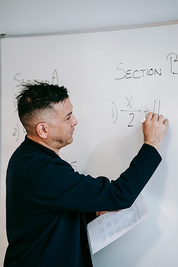 teacher writing, whiteboard, math problem, male teacher, explaining, marker, classroom, education, teaching, section B, x/2 + 11