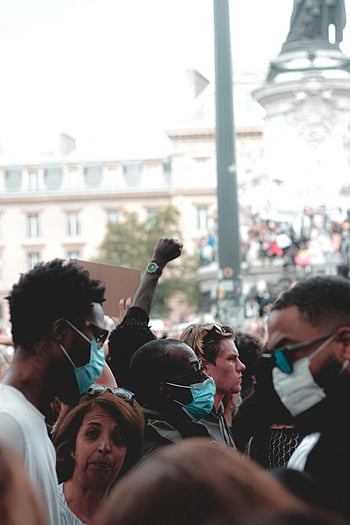 ethnic people, demonstration, diverse group, wearing masks, peaceful protest, outdoor protest, showing solidarity, multi-ethnic crowd, protest rally, public demonstration, solidarity event