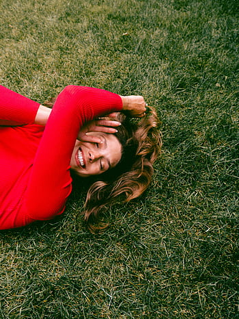 woman, lying, grass, smiling, red sweater, green grass, sunny day, outdoor, happiness, nature, relaxation
