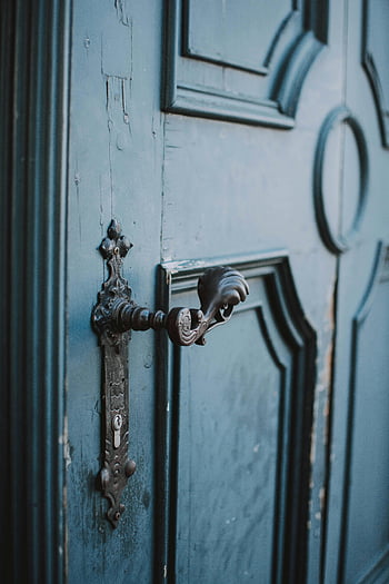 metal door handle, blue wooden door, ornate metal handle, vintage wooden door, close-up, door hardware, antique door, decorative handle, blue door, vintage handle, ornate handle