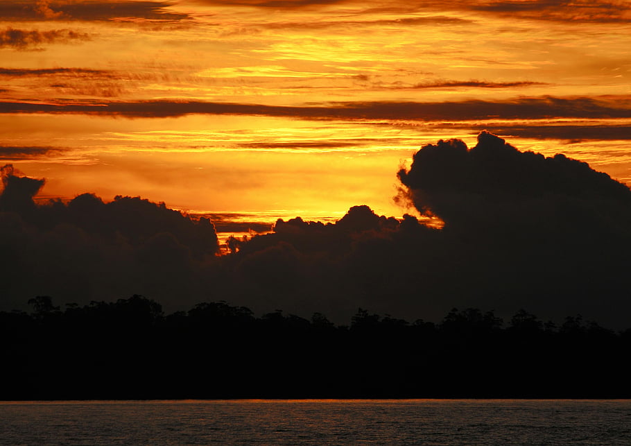 sunset, Agats, Papua, Indonesia, vibrant hues, sea, cloud cover, setting sun, seashore, captivating sunset, evening sky