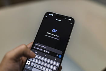 mobile AI chatbot, smartphone interface, AI chatbot, tech themes, AI discussions, DeepSeek chatbot, smartphone display, chatbot interface, mobile technology, AI conversation, smartphone app