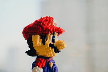 Pixelovaná hračka, detailní záběr, figurka z hračky, populární herní postava, Podrobný detail, mario obrázek, postava lego, pixel umění, fotografování hraček, hračka s herní postavou, LEGO Mario