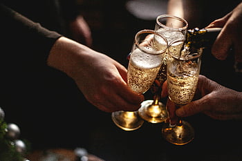 champagne glasses, people toasting, celebration, joy, close-up hands, champagne celebration, festive moment, champagne toast, bubbly drinks, party atmosphere, festive gathering