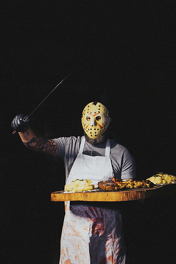 butcher costume, meat board, masked butcher, knife, meat platter, dark background, spooky atmosphere, Halloween costume, horror theme, Jason mask, apron