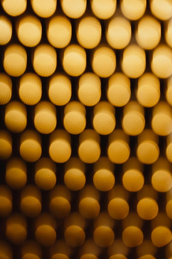 yellow bokeh, black background, warm gold tones, abstract bokeh pattern, soft visual texture, artistic visual, bokeh light, gold bokeh, abstract art, warm bokeh, artistic texture