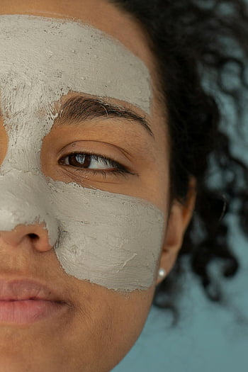 clay mask, skincare routine, young woman, facial mask, close-up, content black woman, beauty treatment, natural skincare, self-care, facial care, curly hair