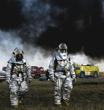 firefighters, aluminized suits, smoke, rescue vehicles, fire scene, black clouds, emergency response, protective gear, fire rescue, rescue operation, fire safety