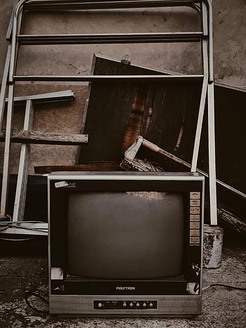 abandoned television, vintage television, classic TV, outdated metal frames, wooden panels, nostalgia, retro TV, Polytron, old electronics, antique TV, abandoned electronics