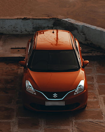 auto rossa, vista aerea, Auto Suzuki, parcheggiato all'aperto, superficie piastrellata, Progettazione del veicolo, Suzuki rossa, Parcheggio all'aperto, design automobilistico, vista dall'alto, veicolo rosso