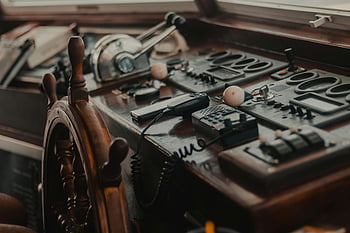 ship captains control, vintage boat, control panel, wooden steering wheel, gadgets, nautical equipment, maritime control, boat dashboard, ship navigation, vintage ship, boat interior