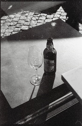 black and white, still life, beverage bottle, glass, table, shadows, beer bottle, wine glass, monochrome photography, drink, table setting