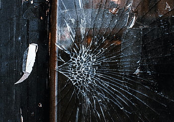 broken glass, wooden surface, cracked window, weathered wooden frame, grunge texture, close-up, shattered glass, damaged window, rustic wood, broken window, grungy surface