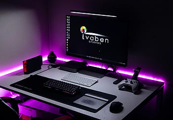 modern computer set, gaming area, LED lighting, gaming console, modern peripherals, stylish setup, computer desk, gaming accessories, purple lighting, gaming controller, computer monitor
