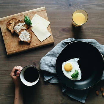 homemade breakfast, fried egg, coffee, cheese, bread, orange juice, inviting breakfast, table setting, morning meal, breakfast scene, breakfast table