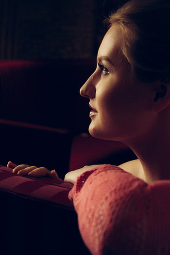 woman in pink top, selective focus photography, side profile, low lighting, contemplation, grace, elegant, young woman, pink top, side view, low light