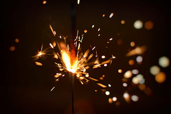 Sparks of Firecracker, close-up, sparking firecracker, bursting light, fireworks energy, firecracker sparks, close-up fireworks, light burst, firecracker close-up, sparkling firecracker, firecracker energy