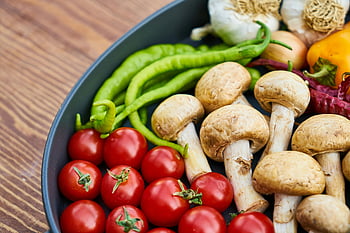 fresh vegetables, mushrooms, tomatoes, green peppers, garlic, wooden surface, close-up, assorted spices, black frying pan, healthy ingredients, cooking ingredients