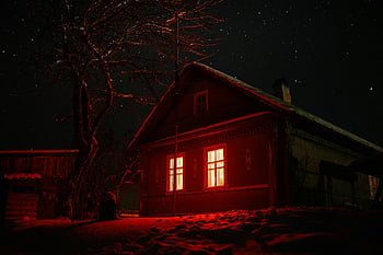 haunted house, eerie, red glowing windows, starry night sky, spooky themes, bare tree, exterior, night scene, creepy, abandoned house, Halloween