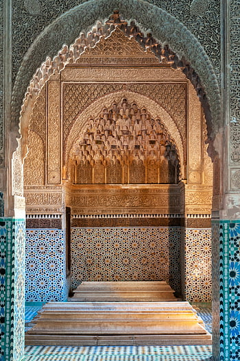 Arabic palace, ornamental arched passage, Saadian Tombs, Islamic architecture, Marrakesh, ornate details, historic site, Moroccan tiles, intricate carvings, blue mosaic, arched design