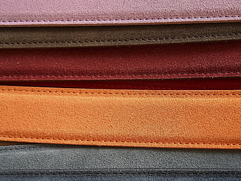 colorful leather belts, detailed stitching, orange rectangular strand, grey rectangular strand, close-up belts, leather accessories, fashion accessories, belt collection, vibrant belts, leather goods, belt stitching