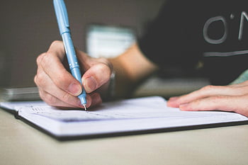 hand writing, blue ballpoint pen, notebook, creativity, close-up, focus on creativity, writing process, blue pen, person writing, detailed shot, creative writing