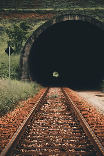 railroad tracks, dark tunnel, vibrant greenery, Ritápolis Brazil, railway tunnel, train tracks, tunnel entrance, green landscape, railway landscape, tunnel photo, rail transportation