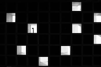 abstract grid, light and shadow, monochrome image, contrasting effects, grid structure, black and white, architectural photography, minimalist design, shadow play, geometric patterns, abstract art