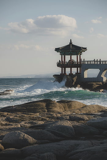 coastal gazebo, ocean waves, scenic view, sunset, traditional gazebo, coastal scene, ocean view, rocky shore, seaside, beach, waves crashing
