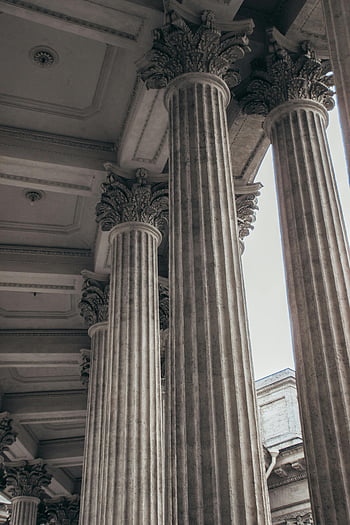 classical columns, Saint Petersburg, architectural grandeur, intricate columns, brown concrete pillars, historical architecture, ornate columns, classical architecture, grand columns, detailed columns, historical pillars