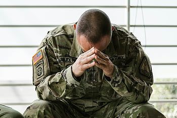 man in military uniform, soldier in camouflage, stressed soldier, overwhelmed soldier, indoor military scene, military stress, army uniform, camouflage uniform, emotional soldier, military personnel, indoor military setting